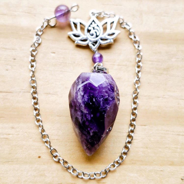 Amethyst faceted pendulum with Lotus charm