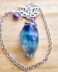 Fluorite faceted pendulum with lotus & om charm